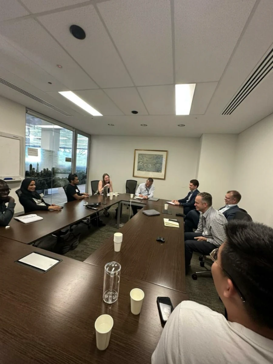 Attendees around the boardroom table at the Digital Government meeting