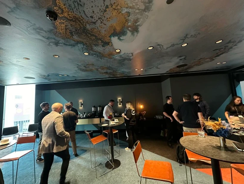 Attendees networking in the Pax8 Mission Briefing room