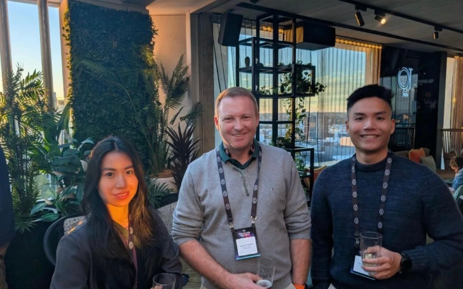 Huu and Uyen from CyberNIQ with a vendor representative at the Pax8 SMB1001 Community Connect in Perth