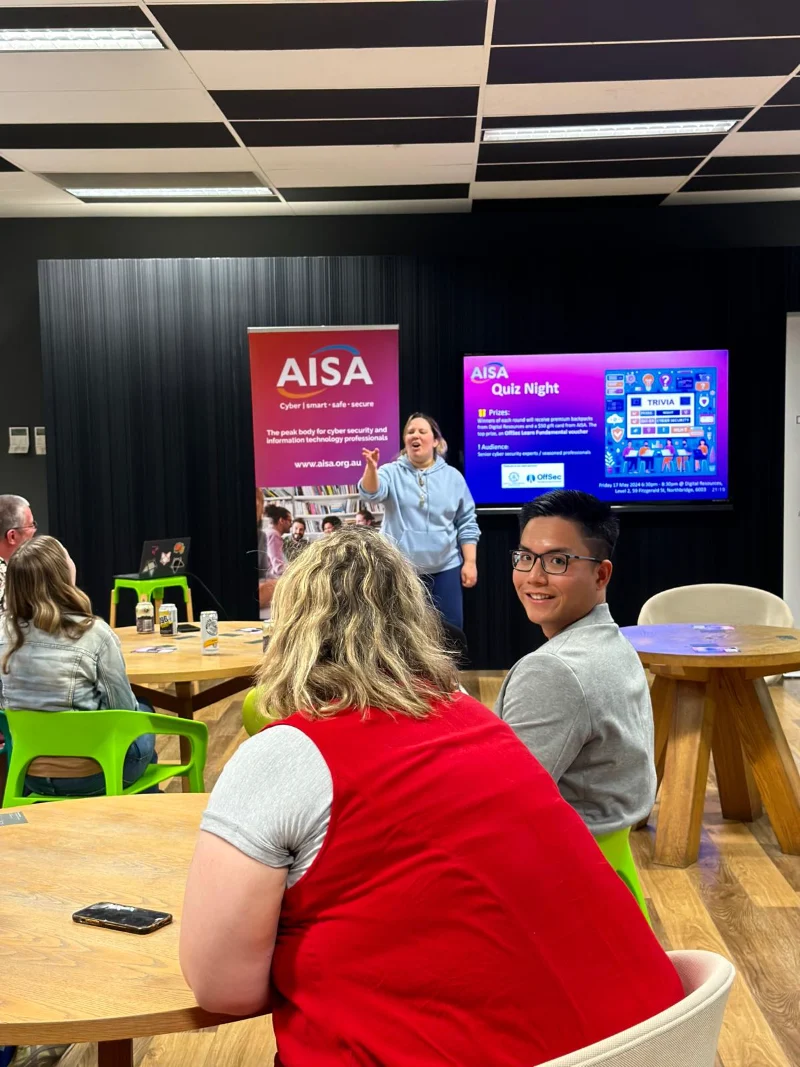 Hoang from CyberNIQ at the AISA quiz night table